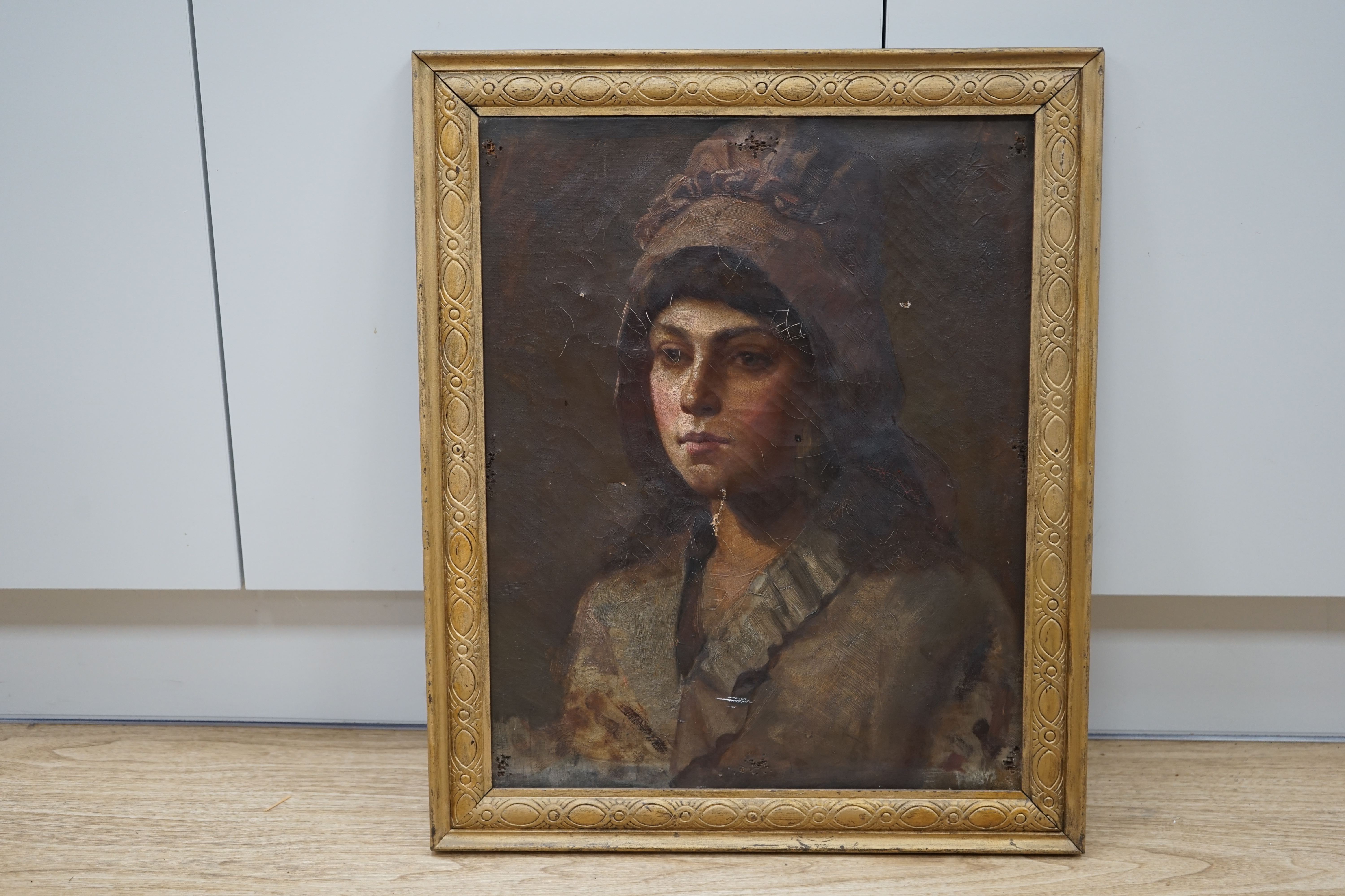 19th century School, oil on canvas, Portrait of a lady wearing a bonnet, unsigned, 50 x 39.5cm, gilt framed. Condition - poor